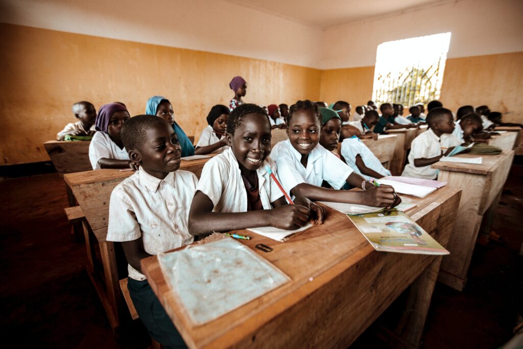 Children in Classroom with Old-fashioned Wooden Desks